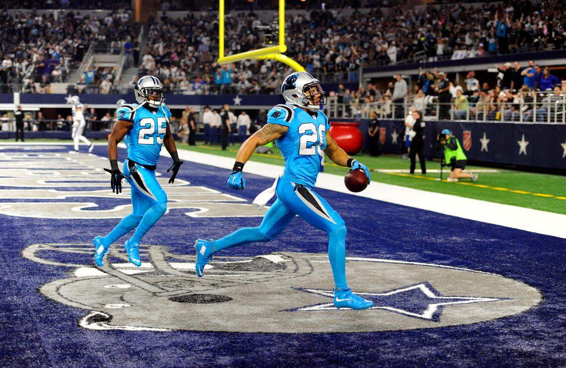 Carolina Panthers safety Kurt Coleman (20) scores a touchdown after intercepting the pass of Dallas quarterback Tony Romo in the first minute of the first quarter during Carolina’s Thanksgiving Day 2015 win.