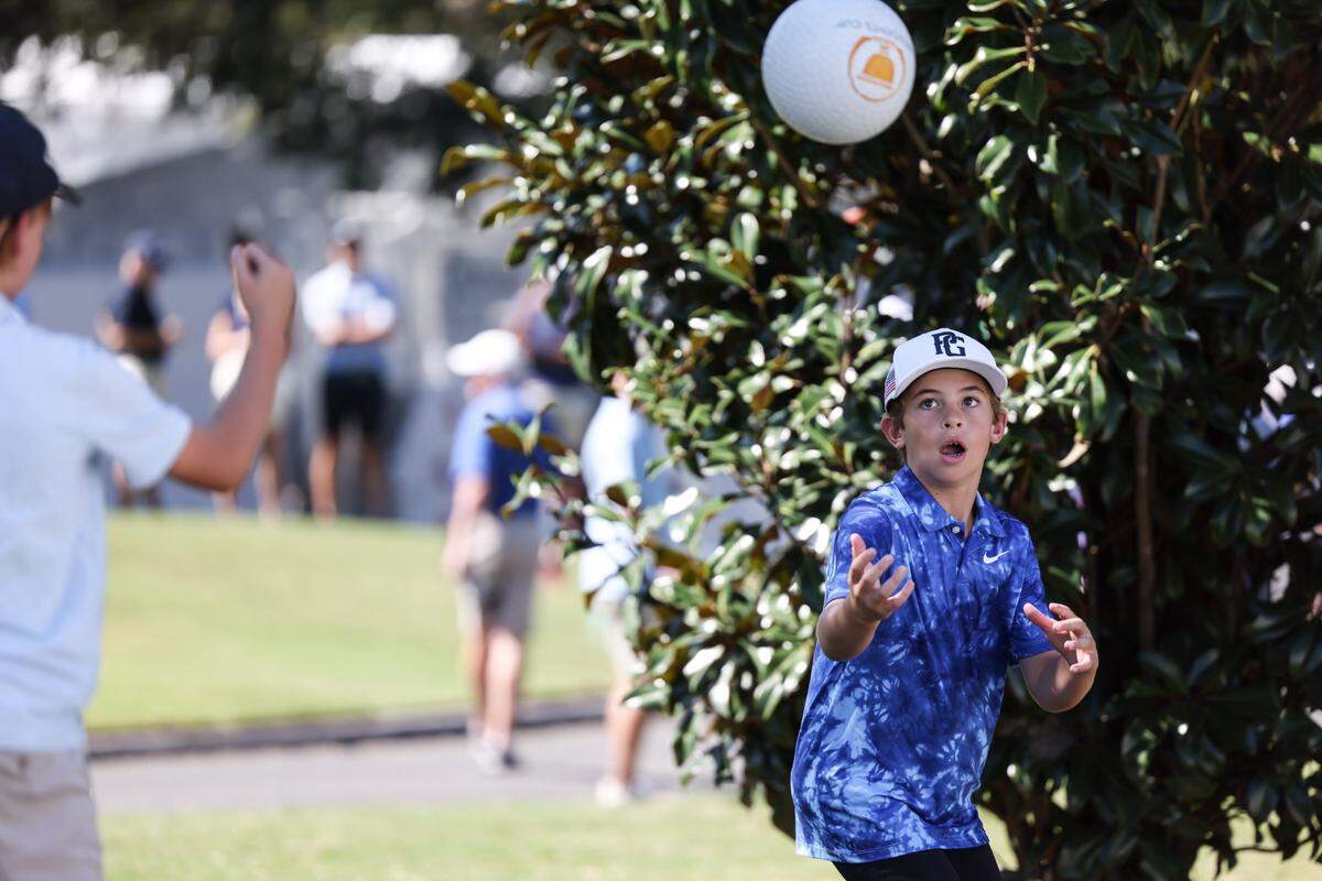 Kids pass ball during the second practice round at the Presidents Cup at Quail Hollow Golf Club in Charlotte, N.C., on Wednesday, September 21, 2022.