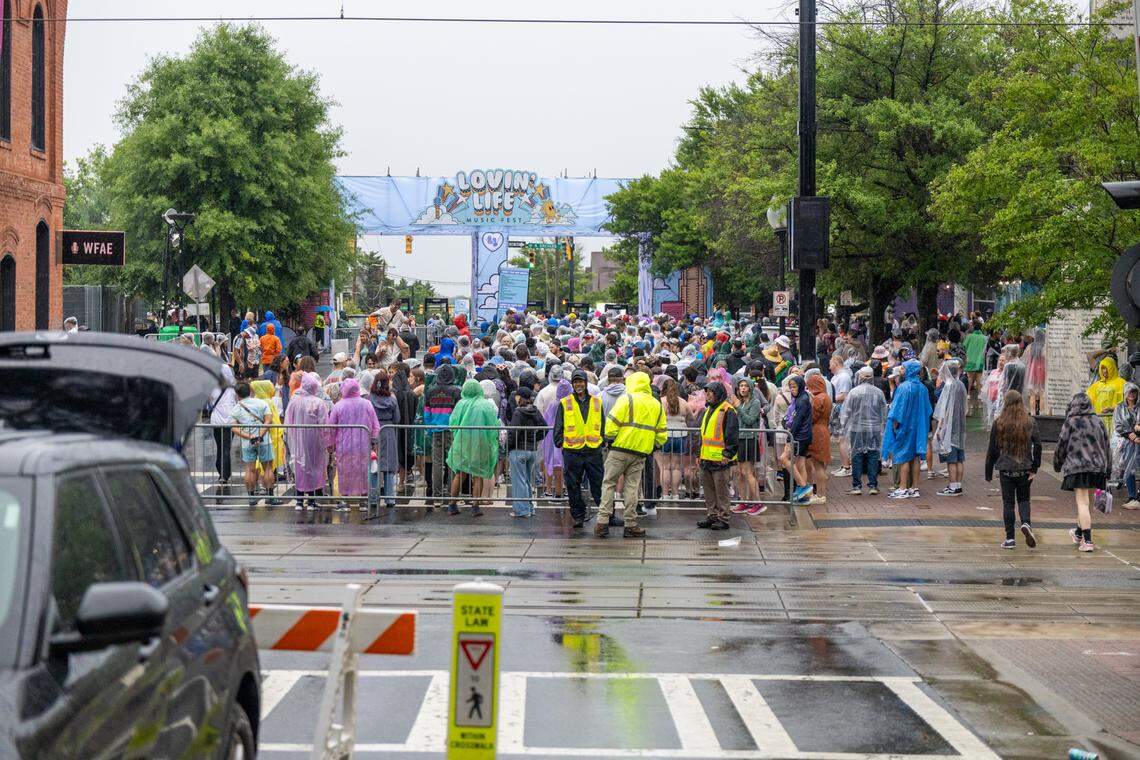 Fans awaiting re-entry after a storm at Lovin’ Life Music Fest.