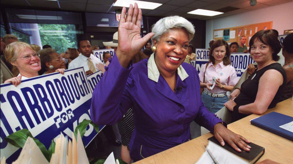 Ella Scarborough formally declares her candidacy for mayor of Charlotte on Aug. 10, 2001 in front of a crowd of supporters. Scarborough, a pioneer in Charlotte and Mecklenburg politics, died on Tuesday, May 25, 2022. She was 75.