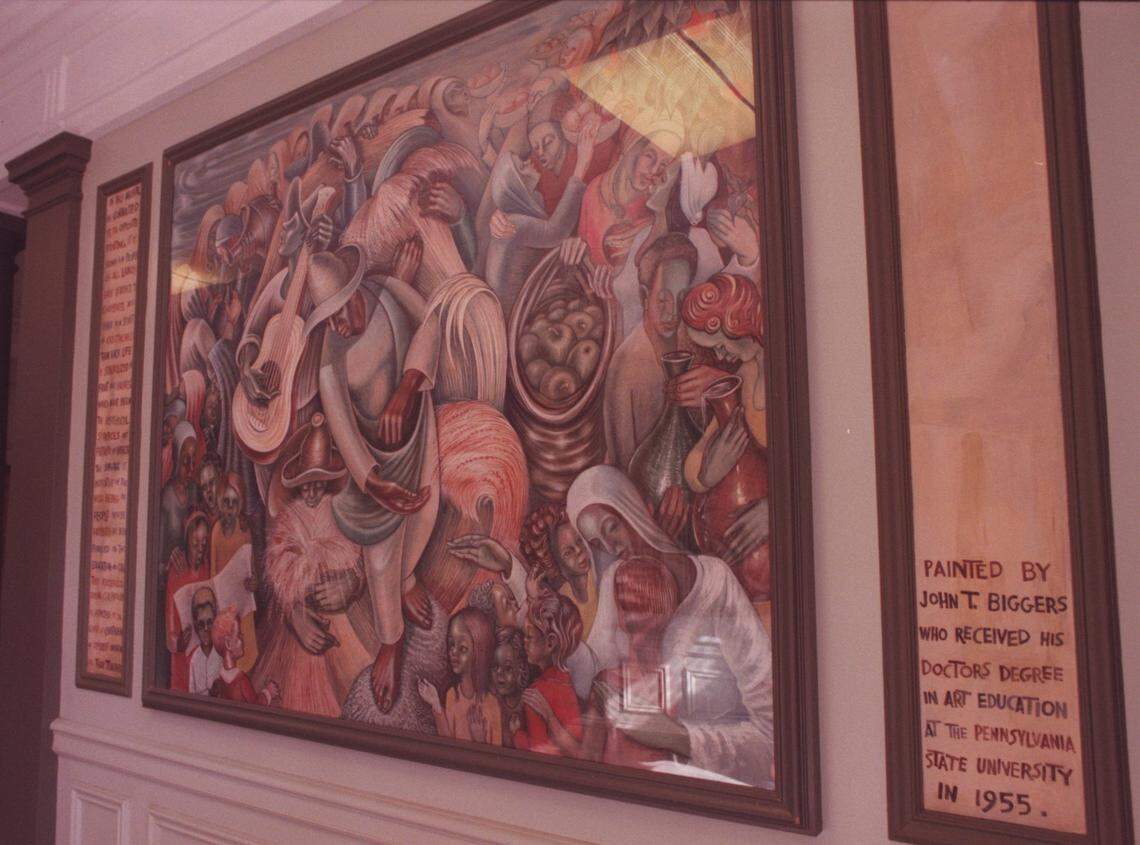 In this 2001 file photo, John Biggers’ “Day of the Harvest” mural is shown in the Burrowes building at Pennsylvania State University.