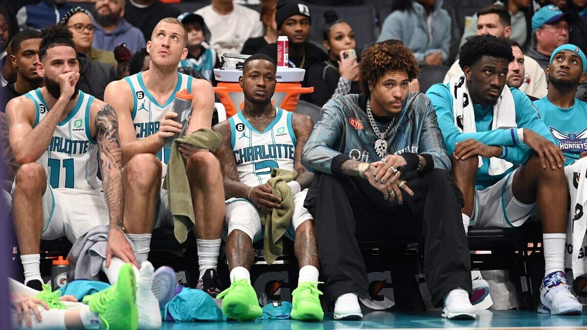 (L-R) Charlotte Hornets forward Cody Martin, center Mason Plumlee, guard Terry Rozier, forward Kelly Oubre Jr., center Mark Williams and forward Jalen McDaniels sit on the team’s bench in the closing moments of second half action against the Memphis Grizzlies on Wednesday, January 4, 2023 at Spectrum Center in Charlotte, NC. The Grizzlies defeated the Hornets 131-107.