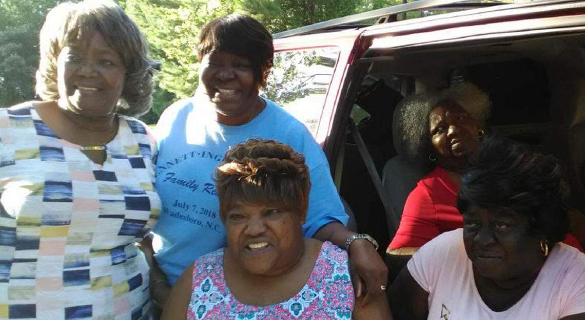 Palestine Howze, in red, with family members.