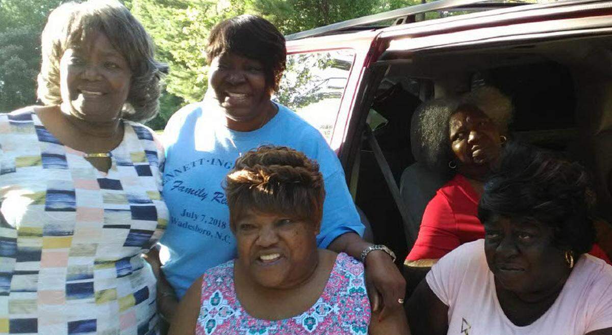 Palestine Howze, in red, with family members.