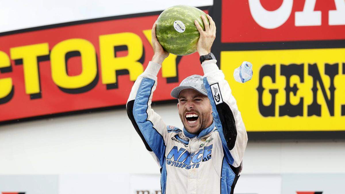Ross Chastain celebrates in Victory Lane after winning a NASCAR Truck Series auto race, Sunday, June 16, 2019, at Iowa Speedway in Newton, Iowa. (AP Photo/Charlie Neibergall)