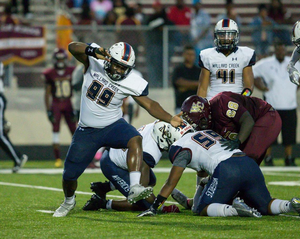 Mallard Creeks’  Noah Kyei (99) sacks West Charlotte’s quarterback Josh Mahatha in the Mavericks’ 55-0 win.