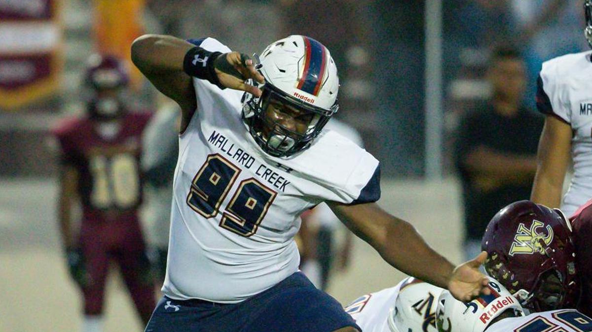 Mallard Creeks’  Noah Kyei (99) sacks West Charlotte’s quarterback Josh Mahatha in the Mavericks’ 55-0 win.