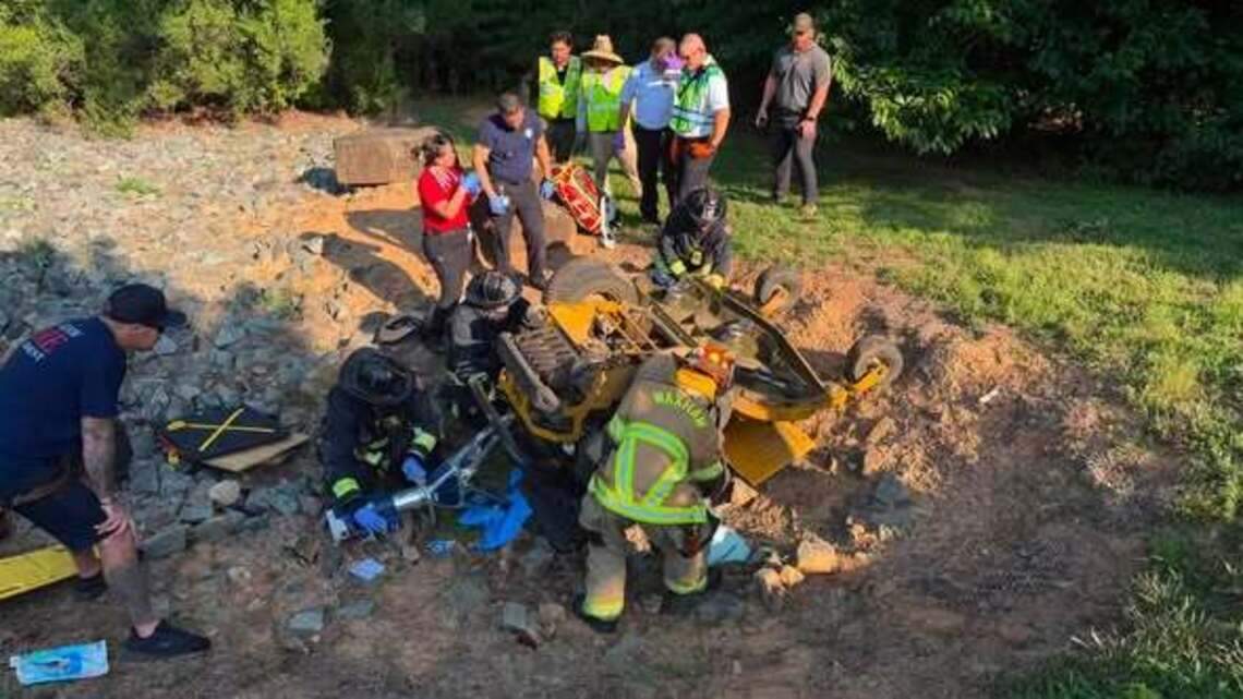 Huge mower rolls over, traps rider, NC responders say. See the rescue.