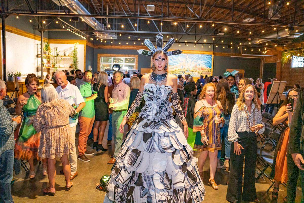 The 2022 Upcycled Fashion Show featured a dress designed by Itala Flores from billboard art created by Jesse Carkin. ArtPop Street Gallery turns to fashion to ensure its billboards don’t end up in landfills.