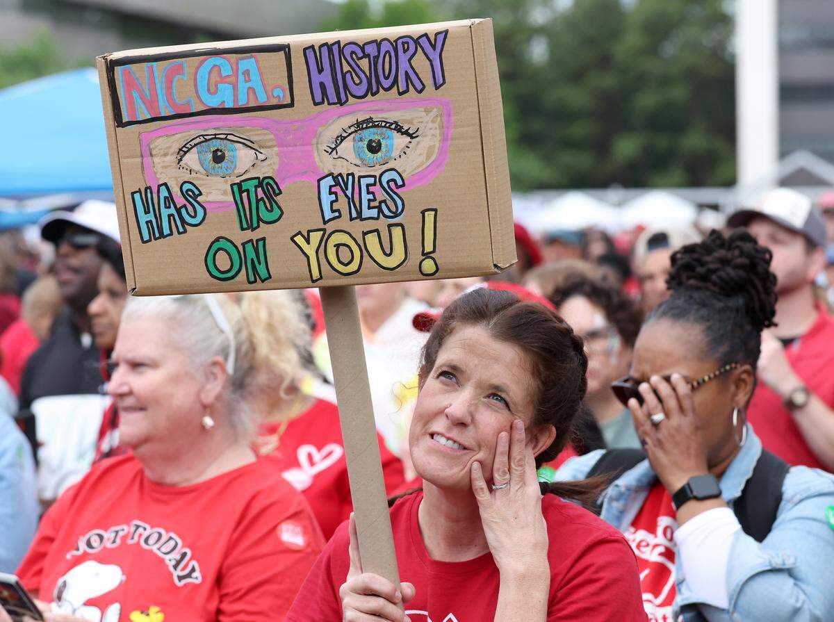 Signs, signs, signs were everywhere as teachers rallied at the Government Complex in Raleigh.