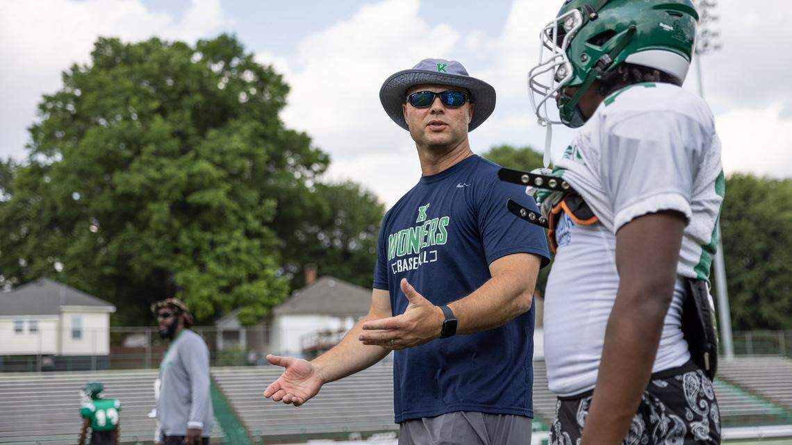 Mike Morton, dentist and former NFL player, helps coach football at A.L. Brown High School in Kannapolis, N.C., on Tuesday, May 19, 2022. Mike Morton will make his referee debut this fall in the NFL.