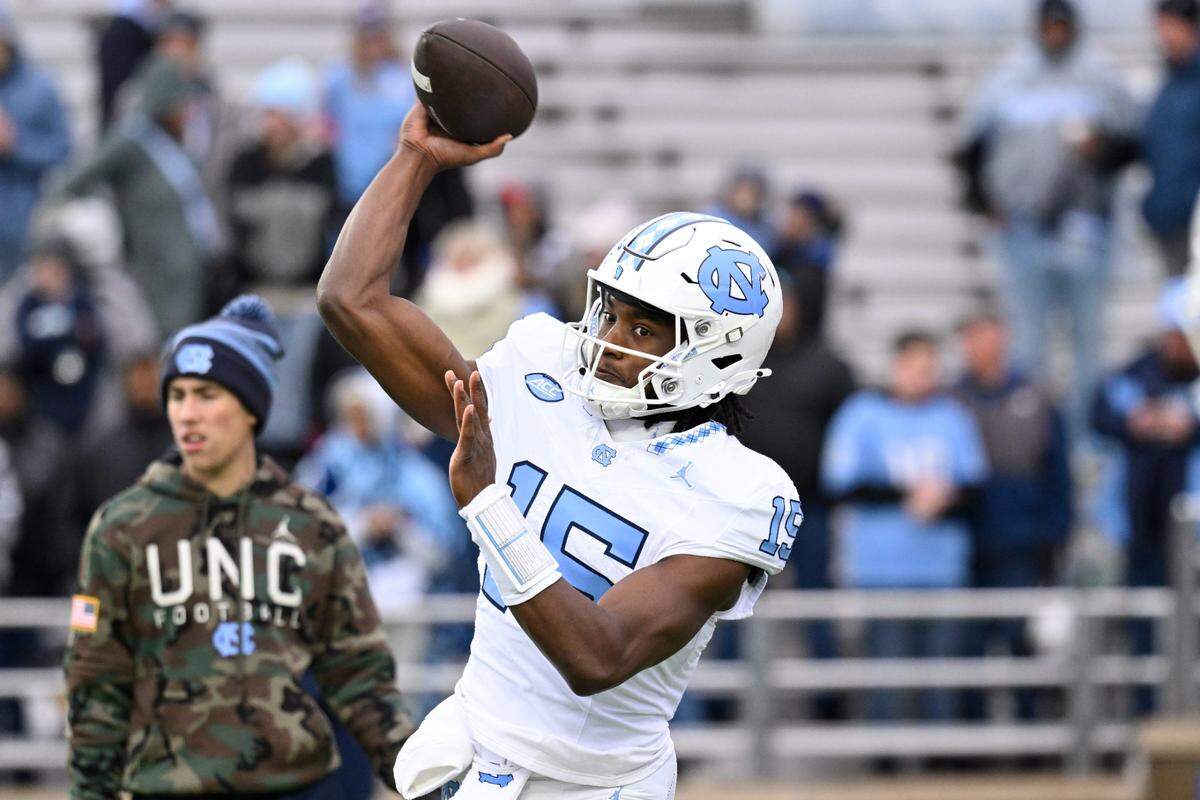 Nov 23, 2024; Chestnut Hill, Massachusetts, USA; North Carolina Tar Heels quarterback Conner Harrell (15) warms up before a game at Alumni Stadium. Mandatory Credit: Eric Canha-Imagn Images