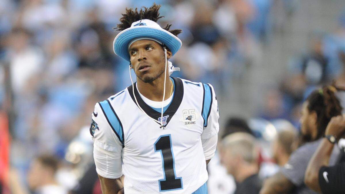 Carolina Panthers quarterback Cam Newton walks the sidelines during the first half an NFL preseason football game against the Buffalo Bills, Friday, Aug. 16, 2019, in Charlotte, N.C. (AP Photo/Mike McCarn)