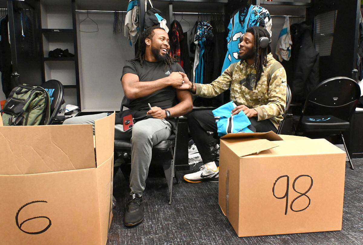 Carolina Panthers cornerbacks Josh Norman, left, and Madre Harper, right, shake hands after Norman gave Harper an autographed jersey on Monday, January 9, 2023. Panthers players packed up their lockers following the conclusion of the team’s season on Sunday, January 8, 2023 with a victory over the New Orleans Saints.