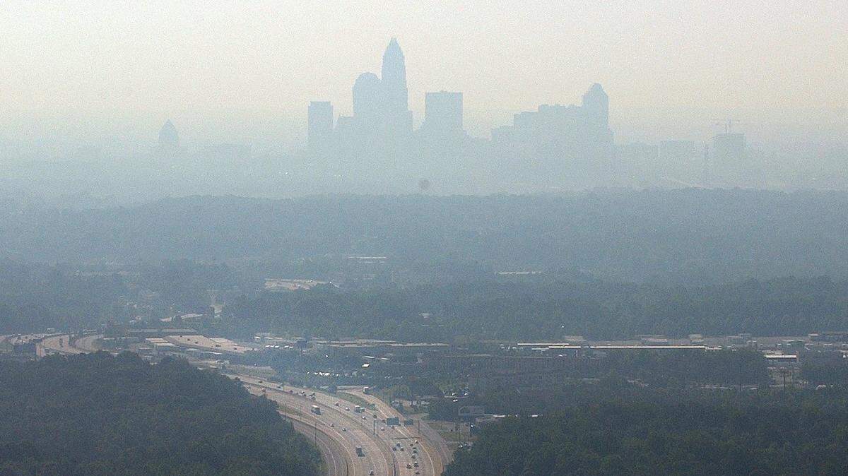 Charlotte’s air quality has improved markedly since 2002, when this photo was taken on a day that haze from airborne particles nearly obscured its skyline.
