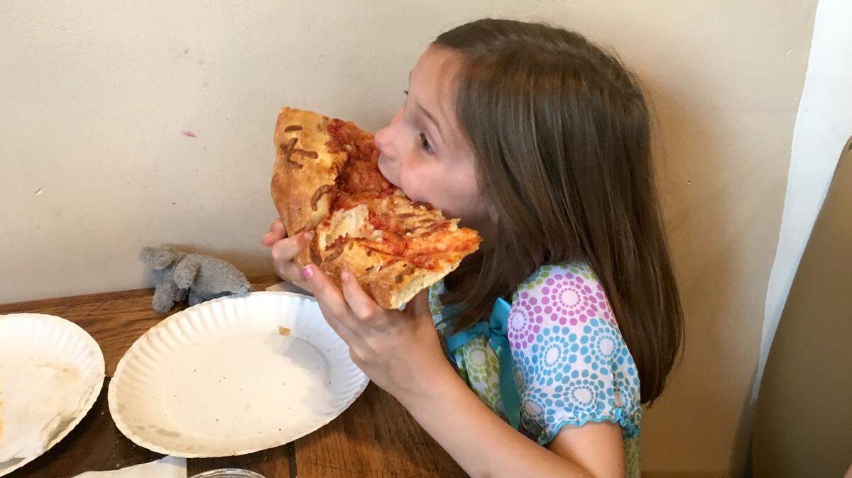 The pizza slices at Benny Pennello’s are bigger than your face. 