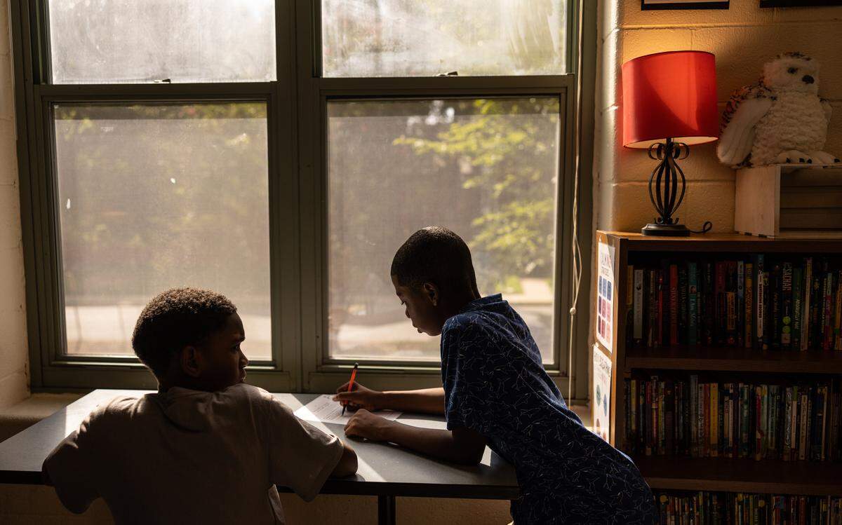 Students get started on their first assignment of the day during the first day of school at Elizabeth Traditional School in Charlotte, N.C., on Monday, August 25, 2025.