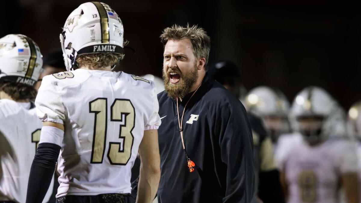 Panther head coach Weslee Ward (center) has a discussion with Shawn Matthews (13) after his touchdown catch. South Meck hosted the Providence Panthers on Friday November 8, 2024.