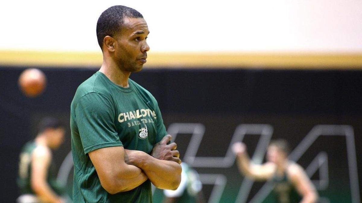 Charlotte 49ers head basketball coach Ron Sanchez watches the team run through drills during practice on Thursday, April 19, 2018.