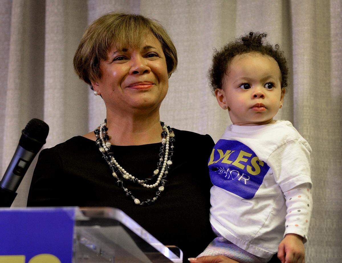 Charlotte Mayor Elect Vi Lyles listens to the applause of supporters with her granddaughter, Arya Alexander, 2 yrs., following her victory over Kenny Smith on Tuesday, November 7, 2017. The victory for Lyles makes her the first African American female to hold the office.