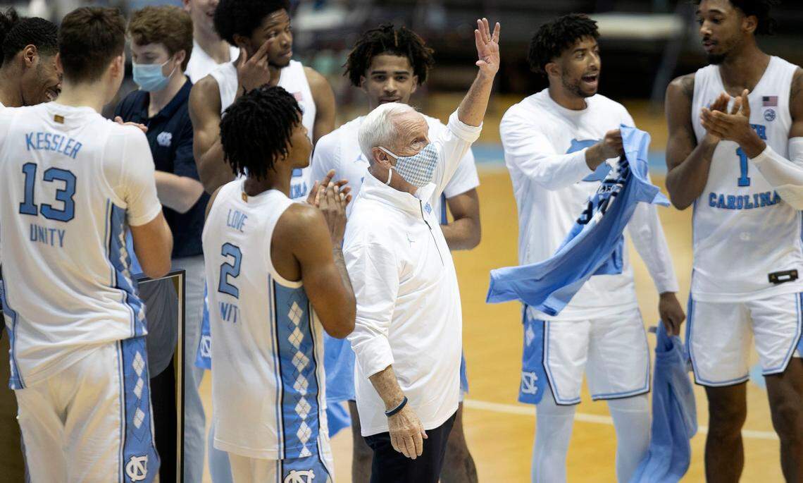North Carolina coach Roy Williams acknowledges the crowd as he is honored for his 900th career win, following the Tar Heelsí 78-70 win over Florida State on Saturday, February 27, 2021 in Chapel Hill, N.C.