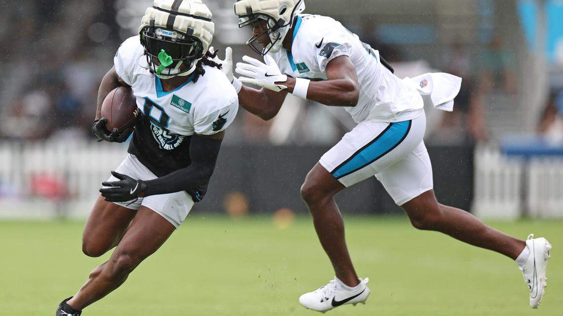 Carolina Panthers cornerback Jaycee Horn, left, runs upfield after catching a ball during practice on Tuesday, August 6, 2024.