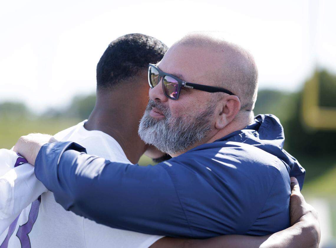Former Mallard Creek coach Mike Palmieri, now coaching in Georgia, greets Trent Simpson during Simpson’s camp at Mallard Creek Saturday. Palmieri coached Simpson in high school