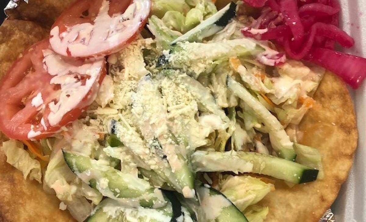 Copan’s taco salad is filled with rice, refried beans, a protein of your choice, shredded lettuce, tomatoes, cucumbers, guacamole, sour cream and pickled red onions.