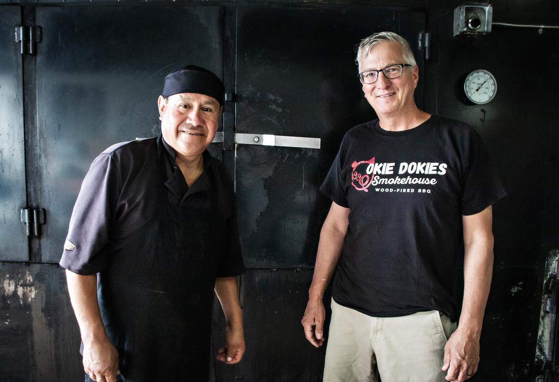 Okie Dokie’s pit boss, José Jaimes, (left) lost his home and his car but has remained with owner Steve Dunning to help rebuild the restaurant and prepare to serve customers again when they can acquire a mobile food trailer.