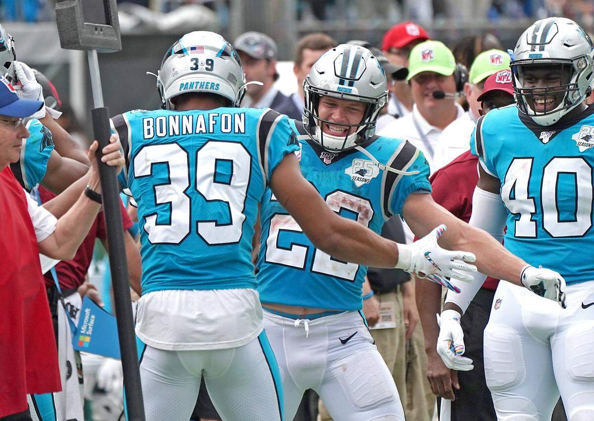 Panthers running back Christian McCaffrey (22) celebrates a touchdown run by running back Reggie Bonnafon (39) that ended up being the game-winning score against Jacksonville.