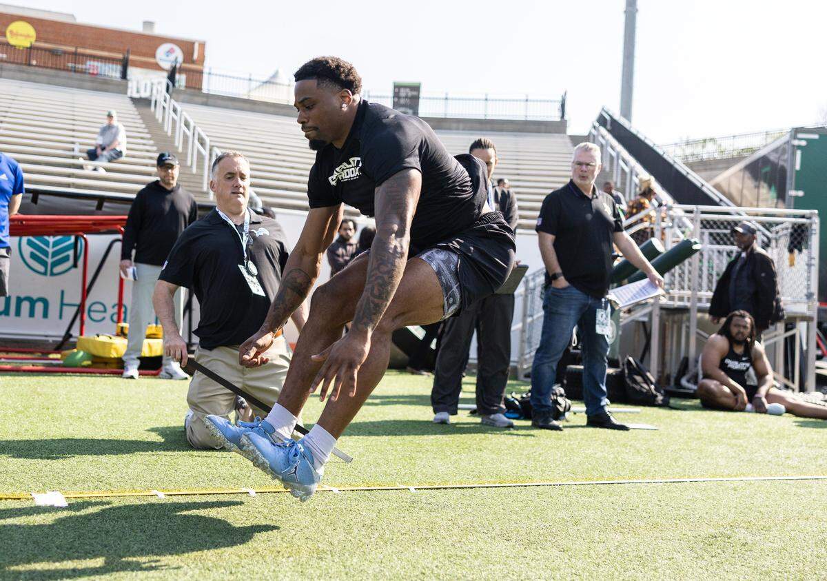 Charlotte 49ers defensive back Ja’Qurious Conley long jumps during the pro day at Jerry Richardson Stadium in Charlotte, North Carolina, on Thursday, March 26, 2026.