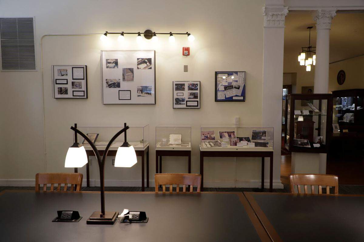 The surviving artifacts from the Mooresville time capsule sit on display at the Mooresville Public Library. Photos and videos are also on display showing the time capsule being put in the ground.