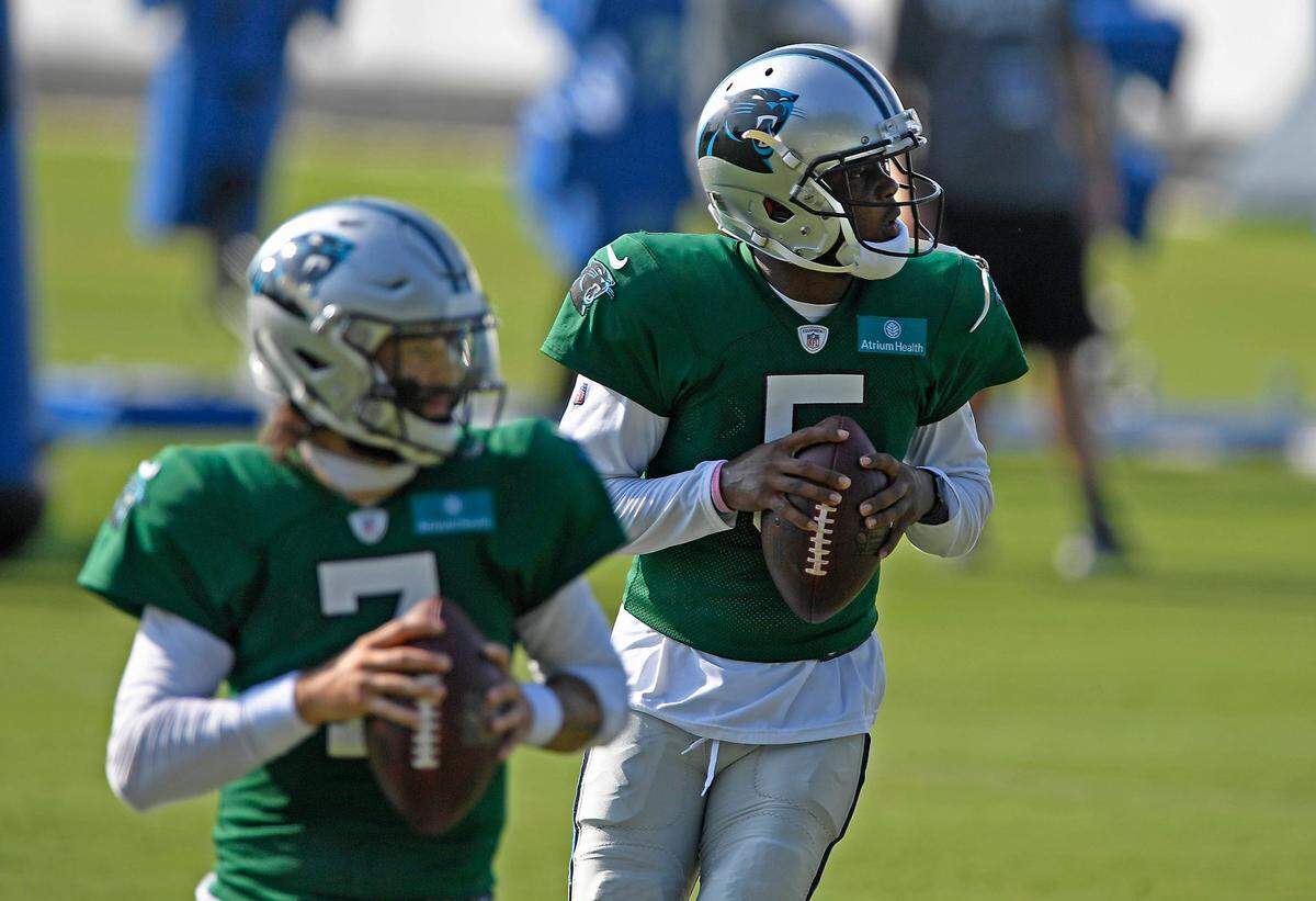 Carolina Panthers quarterback Teddy Bridgewater (5), and quarterback Will Grier (7) drop back to pass during training camp at the team’s training facility on Monday, August 17, 2020.