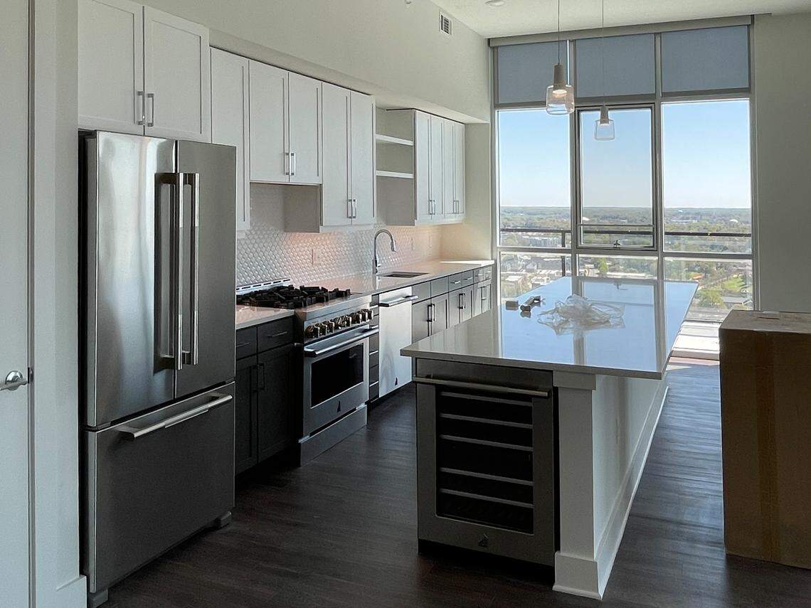 This penthouse kitchen at The Ellis includes upgraded appliances and a view overlooking the city.