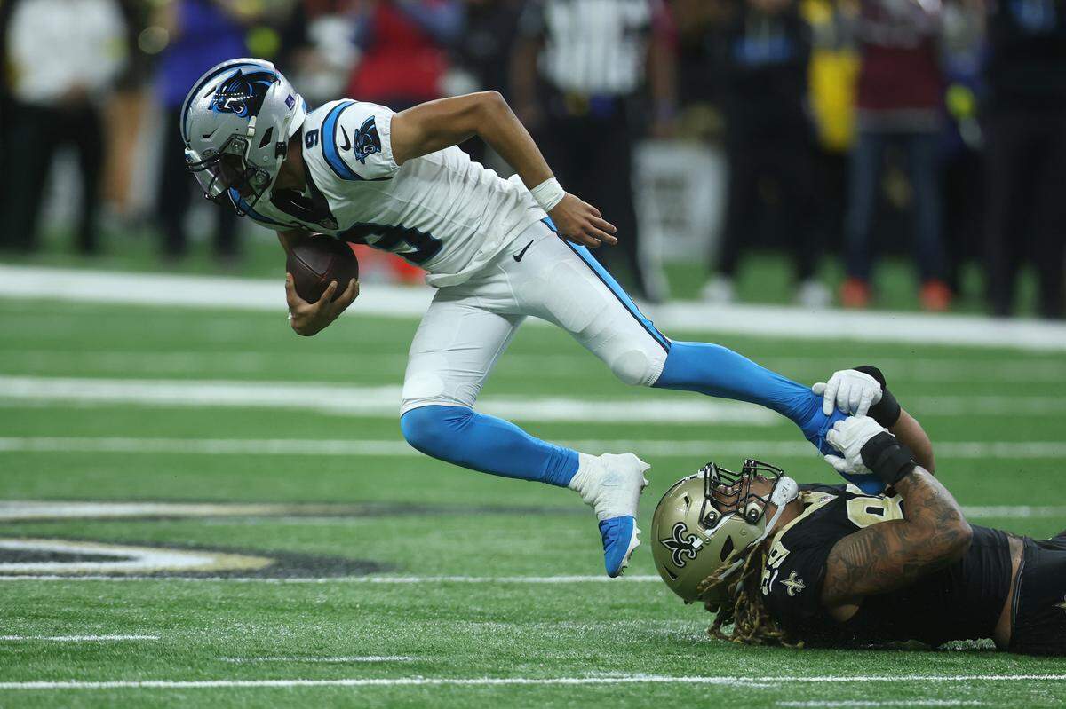 New Orleans Saints defensive end Chase Young (99) tackles Carolina Panthers quarterback Bryce Young during fourth-quarter action Sunday at Caesars Superdome. 
