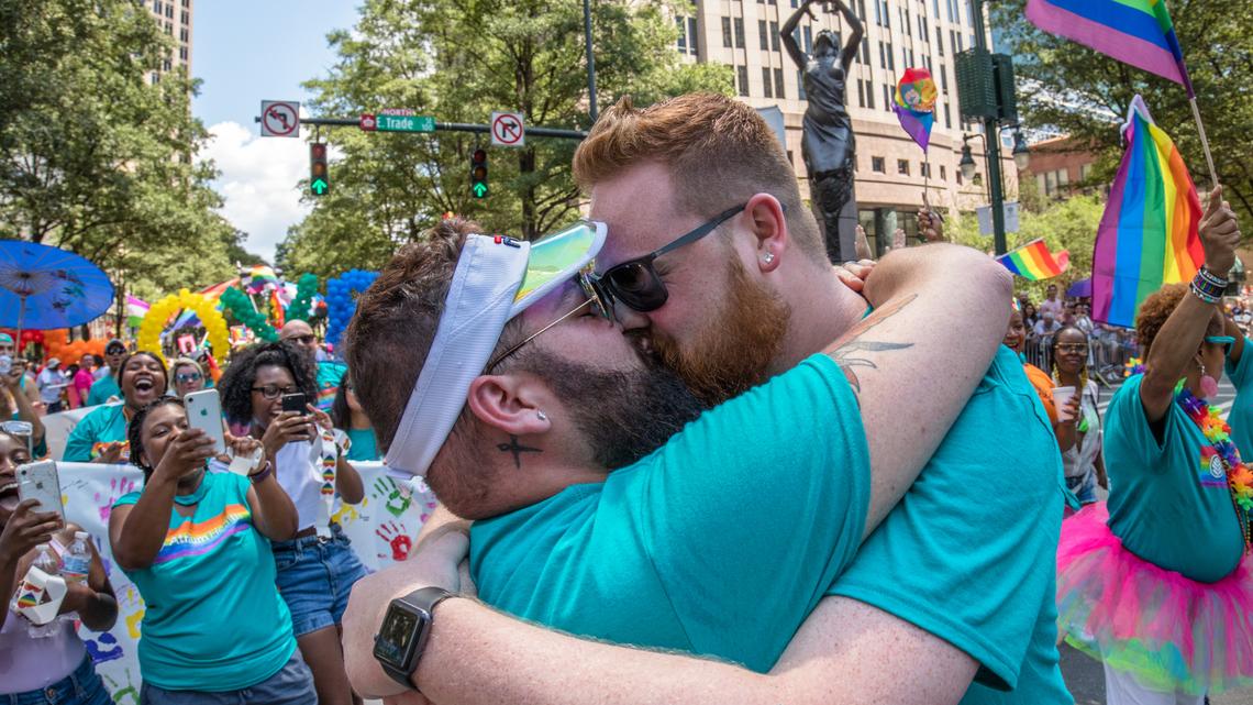 The Gaston County manager ordered this photograph of two newlywed men kissing at the 2019 Charlotte Pride Parade & Festival pulled from a photography exhibit at the Gaston County Museum, according to a county statement and the photographer, Grant Baldwin. 