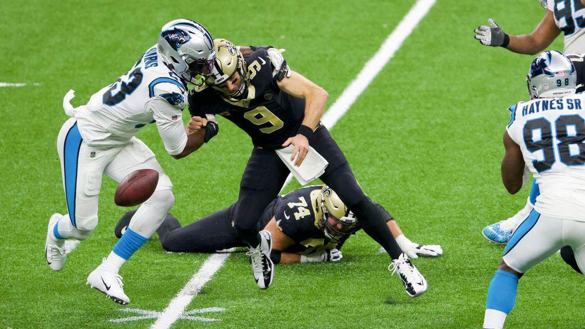 New Orleans Saints quarterback Drew Brees (9) is sacked by Carolina Panthers defensive end Brian Burns (53) in the second quarter at the Mercedes-Benz Superdome on Sunday, October 25, 2020, in New Orleans.