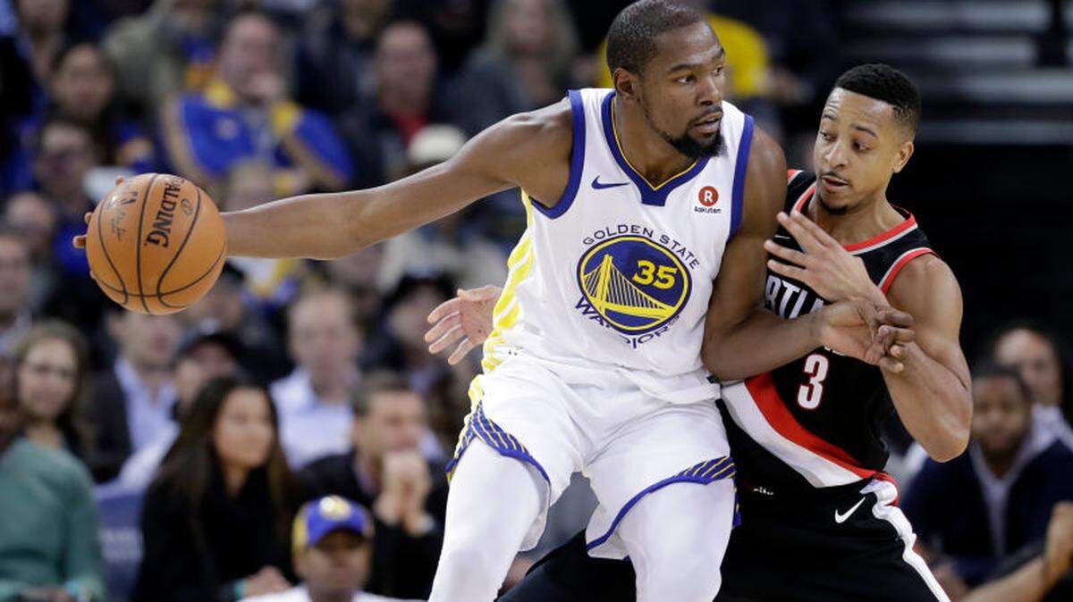Golden State star Kevin Durant recently got into a Twitter fight with Portland’s C.J. McCollum, right, after McCollum criticized Durant’s move from Oklahoma City to Golden State.