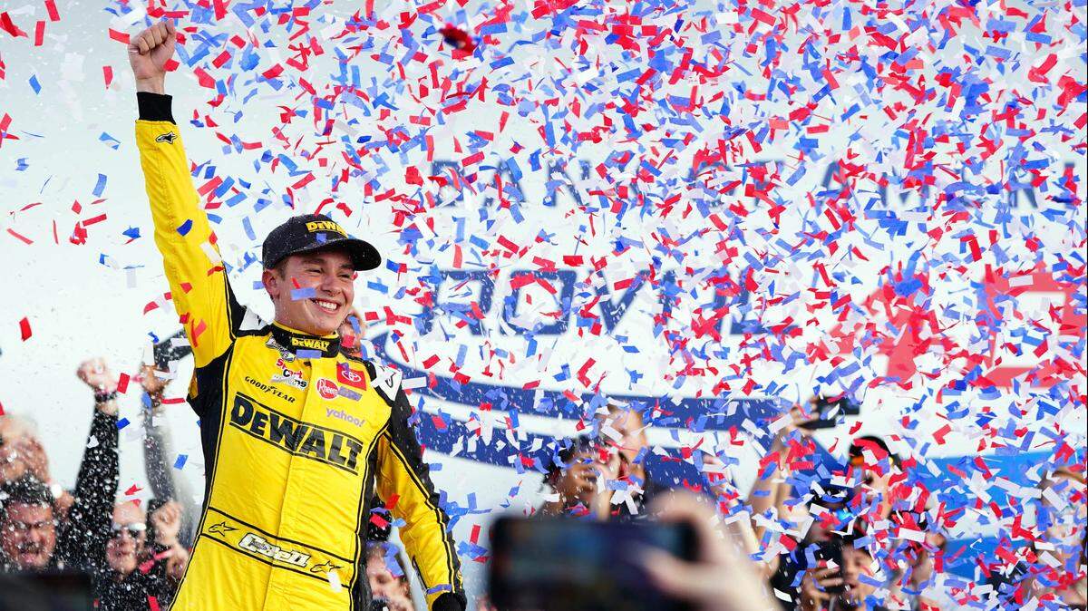 Oct 9, 2022; Concord, North Carolina, USA; NASCAR Cup Series driver Christopher Bell (20) celebrates winning the Bank of America ROVAL at Charlotte Motor Speedway Road Course.