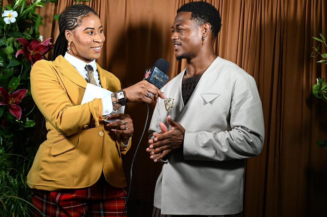 Host and MC Daja Britt, left, interviews an attendee during “Superfine at the Gantt: Exploring Black Dandyism” at The Harvey B. Gantt Center, Friday, May 2, 2025, in Charlotte, N.C.