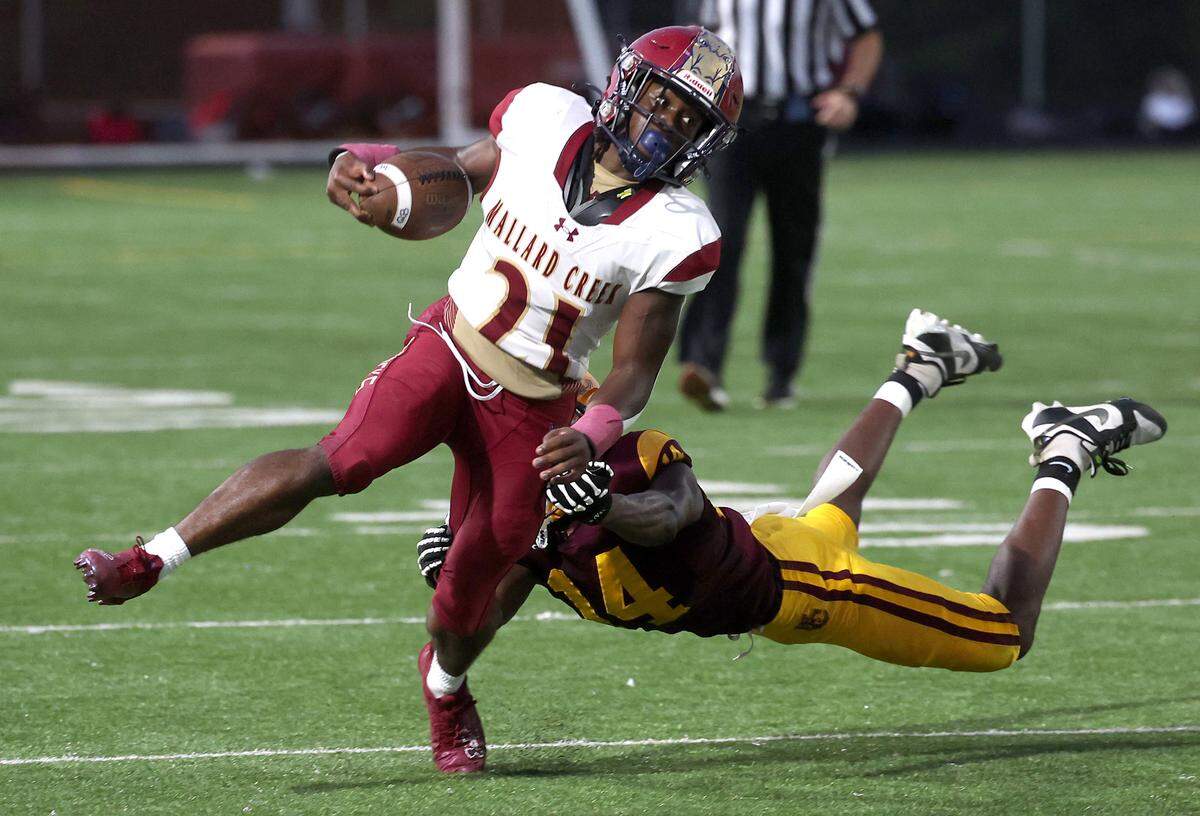 Mallard Creek Mavericks Nassor Ashenafi, left, fights to pick up extra yardage as West Charlotte’s Davion Jones, right, looks to make the tackle during action on Friday, September 20, 2024 at West Charlotte High in Charlotte, NC.