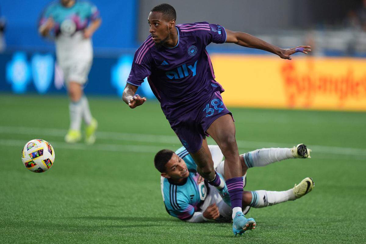 Charlotte FC forward Iuri Tavares (38) dribbles against Minnesota United on Sunday at Bank of America Stadium.