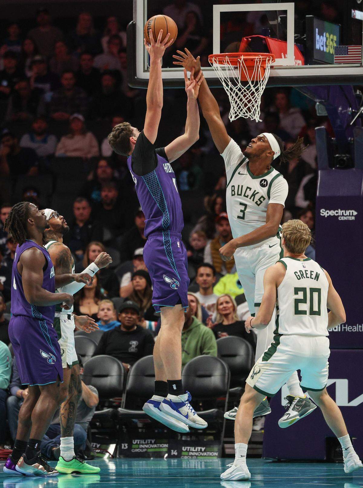 Bucks center Myles Turner tries to block a shot by Hornets center Ryan Kalkbrenner during the game at Spectrum Center in Charlotte, NC on Wednesday, November 12, 2025.