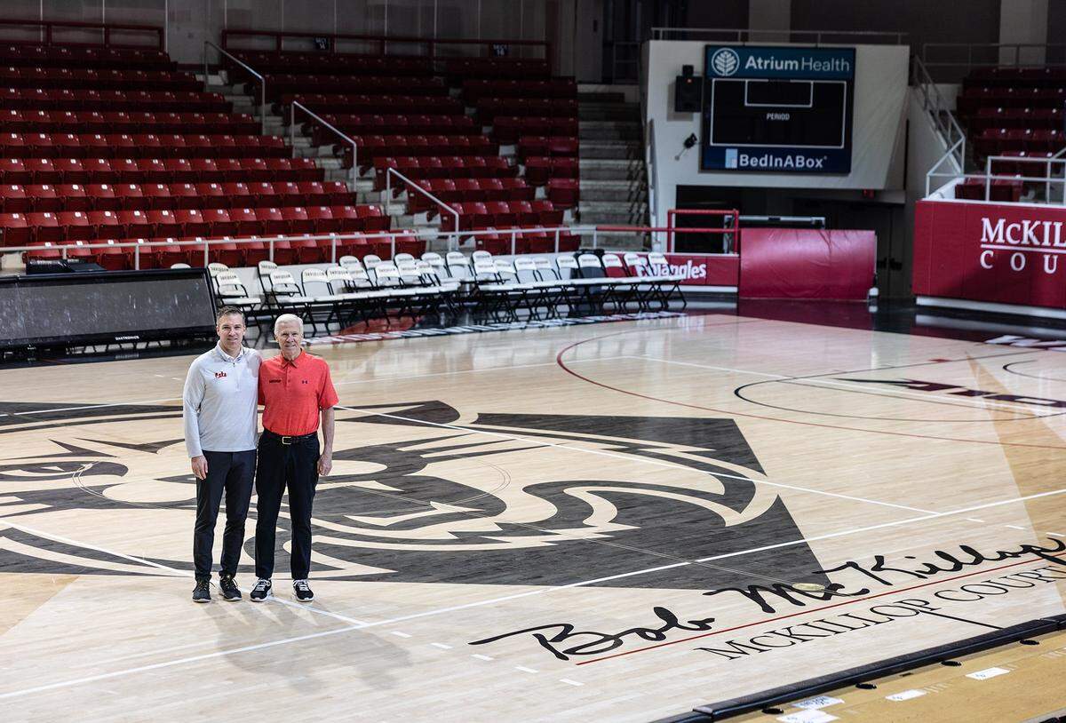 Matt McKillop, left, and his dad, Bob, pose for a portrait at John M. Belk Arena in Davidson, N.C., on Wednesday, February 8, 2023.