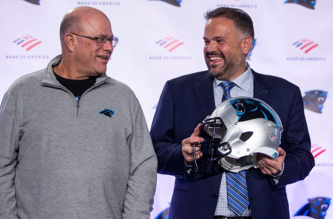 Panthers owner David Tepper and head coach Matt Rhule laugh before taking group photos at Rhule’s introductory press conference in Charlotte on Jan. 8, 2020.