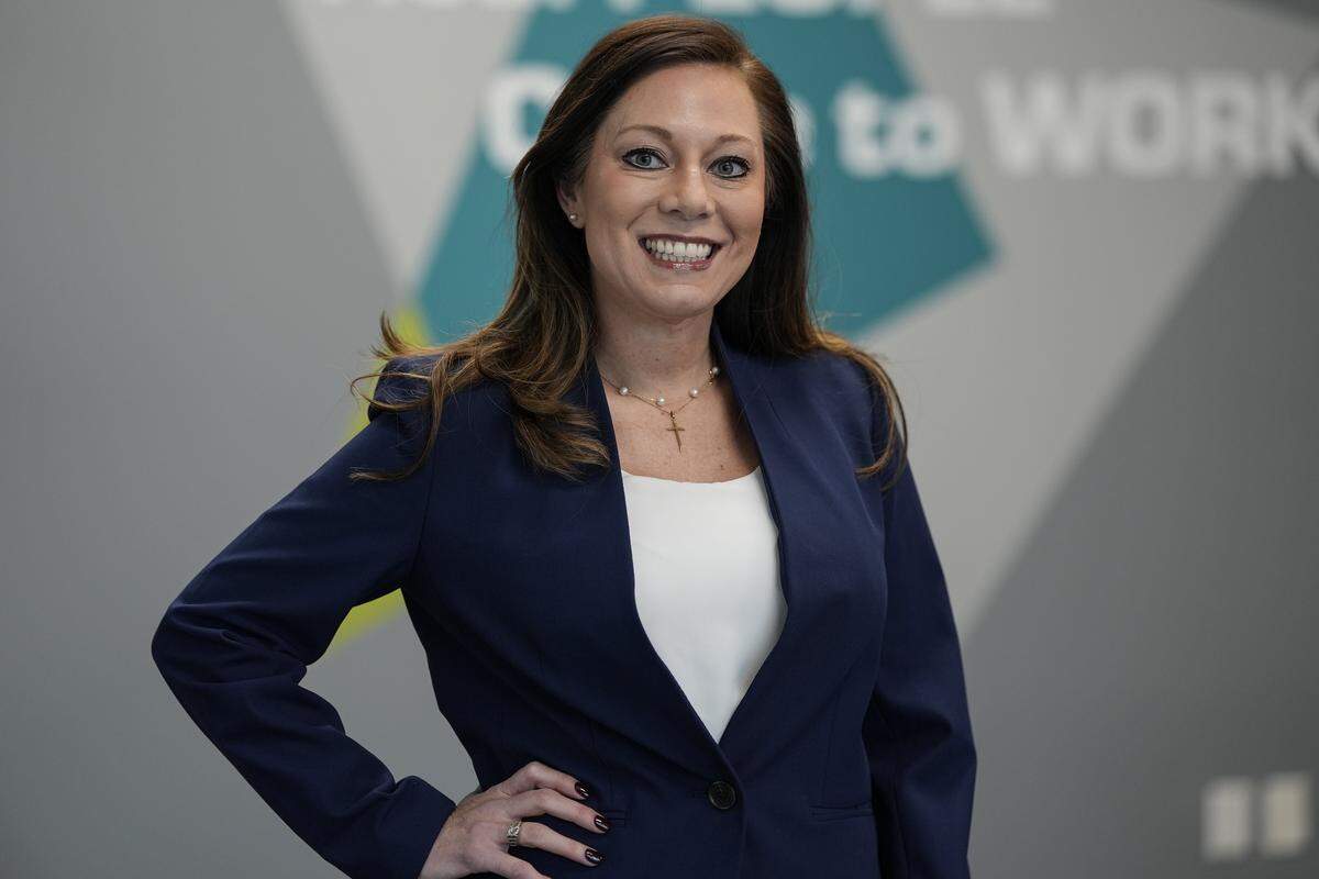 Anna London, member-elect for the Charlotte-Mecklenburg Schools Board of Education representing District 6 poses for a photo, Friday, Dec. 5, 2025, in Charlotte, N.C.