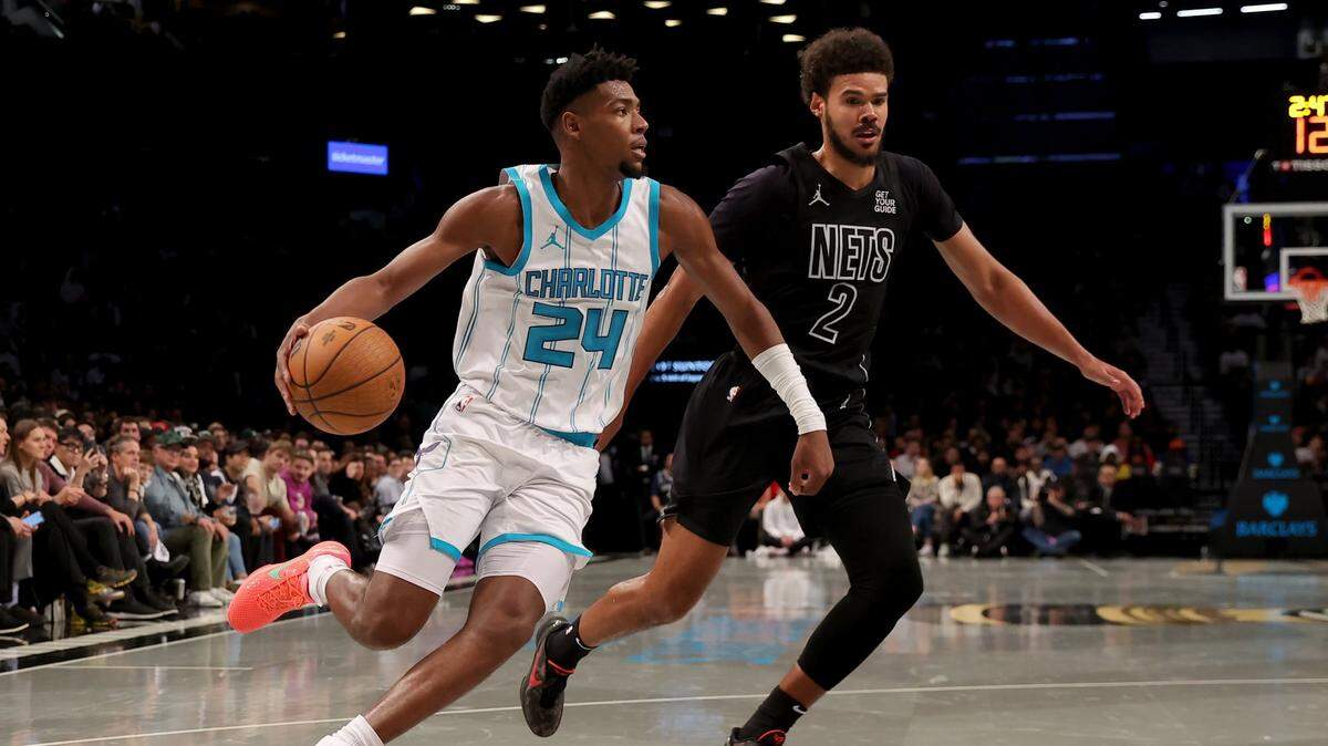 Charlotte Hornets forward Brandon Miller (24) controls the ball against Brooklyn Nets forward Cameron Johnson (2) during the second quarter at Barclays Center. 