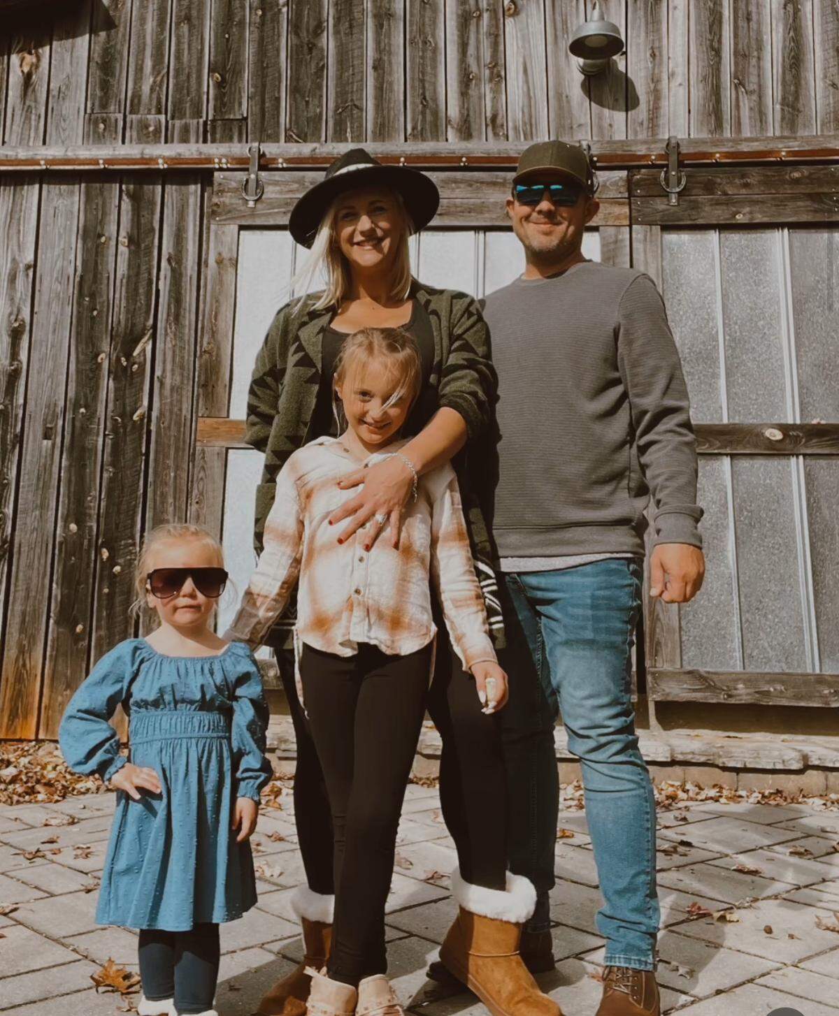 Riverside Drive residents Anna and Mark Davis, with their daughters Piper (left) and Teagan.