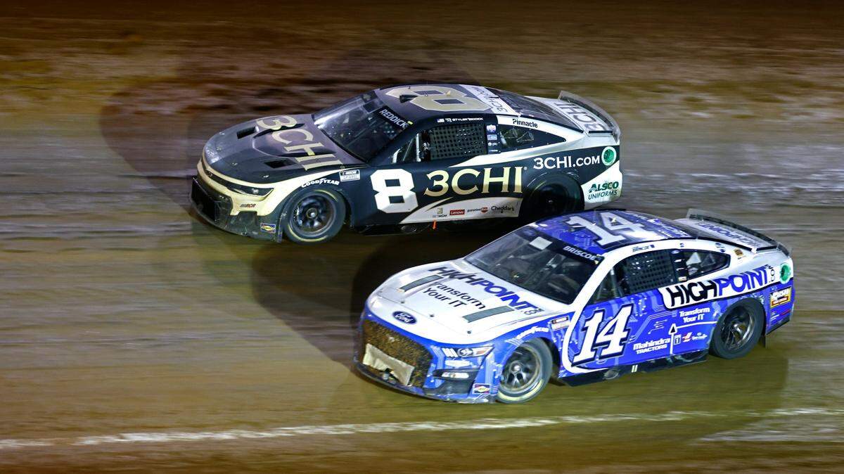 Driver Chase Briscoe (14) gets loose as he and driver Tyler Reddick (8) race into turn 4 during Sunday’s NASCAR Cup Series race in Bristol, Tenn. (AP Photo/Wade Payne)