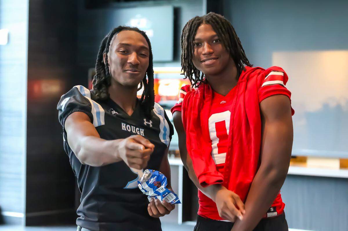 Hough’s Samari Matthews (left) and South Pointe’s J’Zavien Currence at Wednesday’s Carolina Panthers’ Keep Pounding media day at Bank of America Stadium on May 7, 2025
